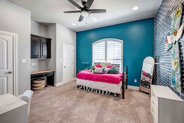 bedroom featuring a ceiling fan, recessed lighting, light colored carpet, and baseboards