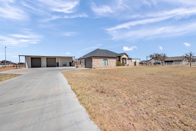 view of front facade with a garage and fence