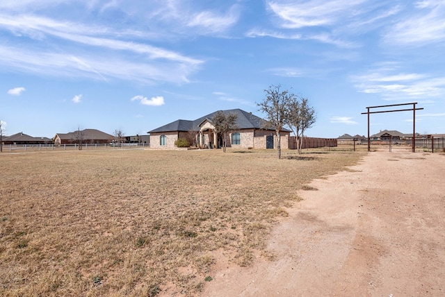 view of front of home featuring fence