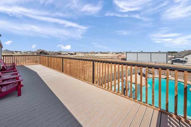 wooden deck with a swimming pool