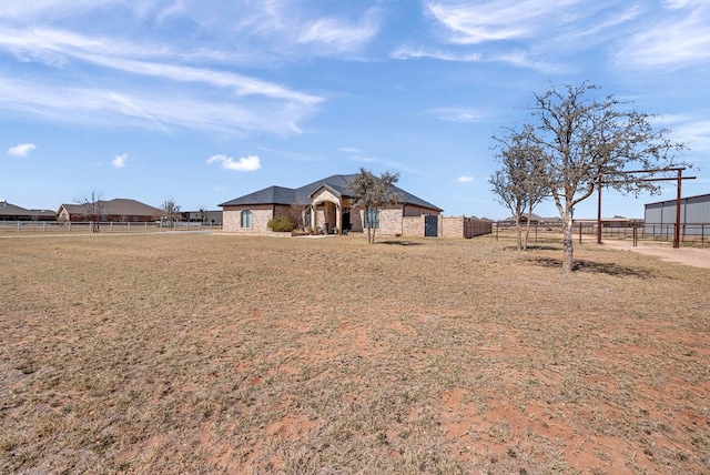 ranch-style house with fence