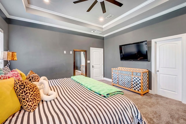 carpeted bedroom with visible vents, recessed lighting, a raised ceiling, and ornamental molding