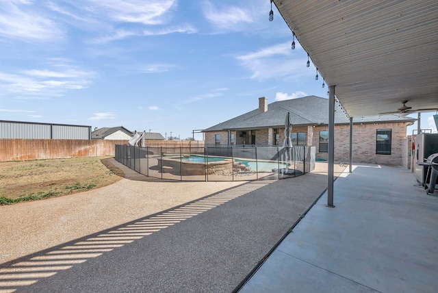 view of patio featuring a fenced backyard and a fenced in pool