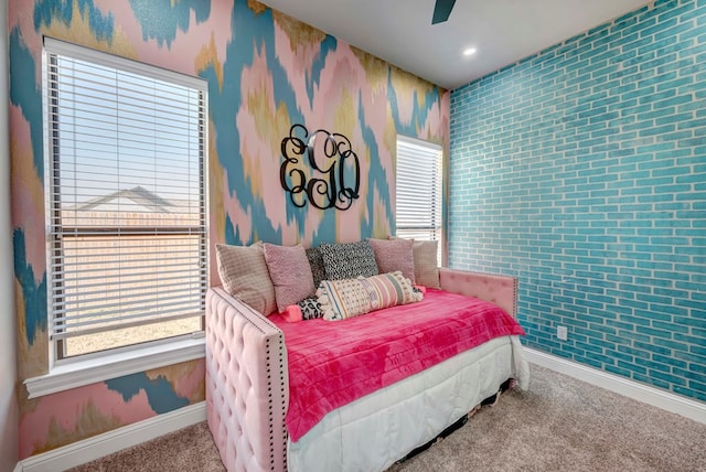 bedroom featuring carpet flooring, multiple windows, wallpapered walls, and baseboards