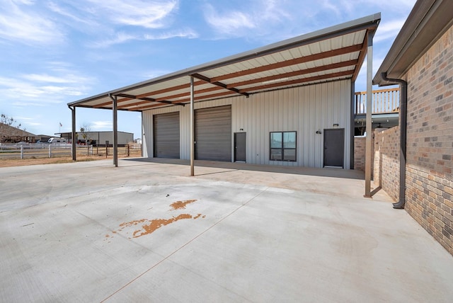 view of outbuilding featuring an outdoor structure and fence