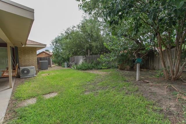 view of yard featuring central AC unit and ac unit