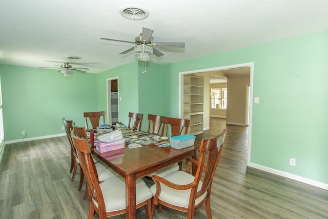 dining space with ceiling fan and hardwood / wood-style flooring