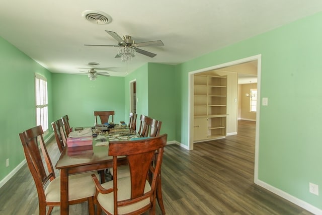 dining space featuring dark hardwood / wood-style flooring and ceiling fan