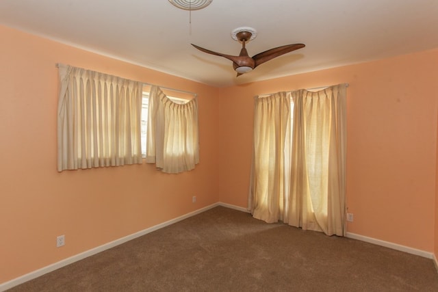 spare room with carpet flooring and ceiling fan