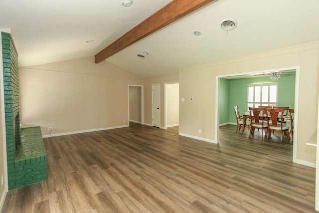 unfurnished living room with vaulted ceiling with beams and dark wood-type flooring