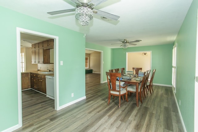 dining space featuring hardwood / wood-style flooring, a healthy amount of sunlight, and sink