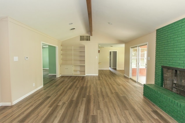 unfurnished living room featuring lofted ceiling with beams, dark hardwood / wood-style flooring, and a brick fireplace