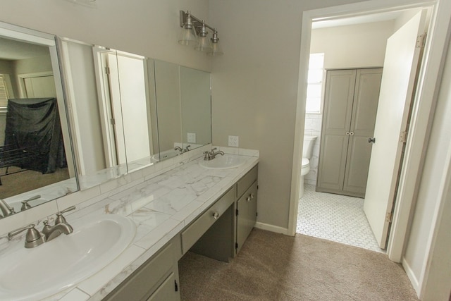 bathroom with vanity and toilet