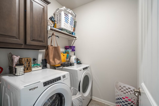 laundry room with cabinet space and independent washer and dryer