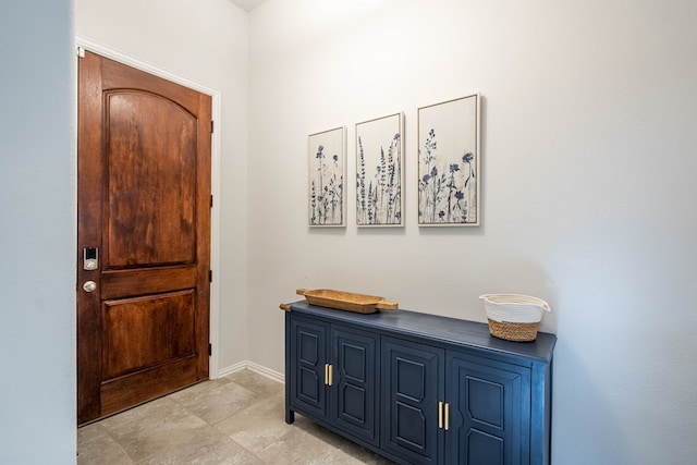 foyer entrance with baseboards