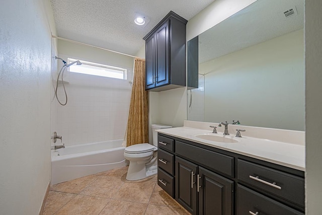 full bathroom featuring shower / bathtub combination with curtain, vanity, a textured ceiling, tile patterned floors, and toilet