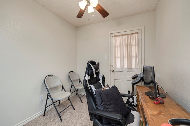 office area featuring ceiling fan, baseboards, carpet floors, and a textured ceiling