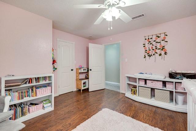 rec room with visible vents, baseboards, a ceiling fan, and wood finished floors