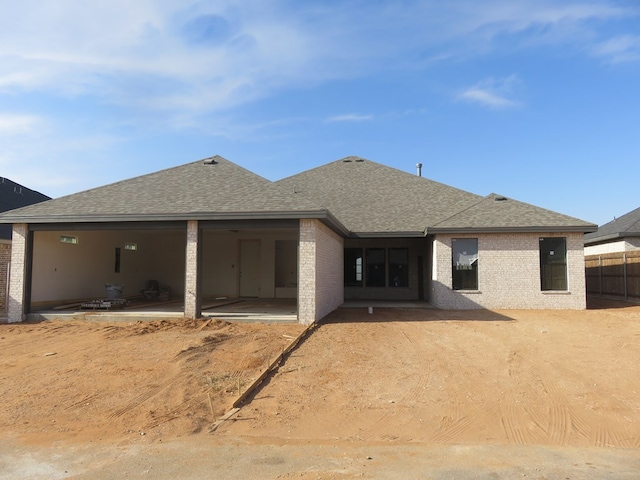 rear view of house featuring a patio