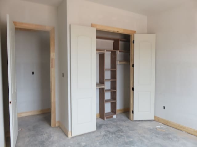 unfurnished bedroom featuring light carpet