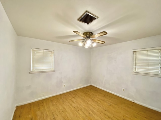 2107 Alabama St, Big Spring, TX 79720 - spare room featuring light wood-style flooring, baseboards, and a ceiling fan