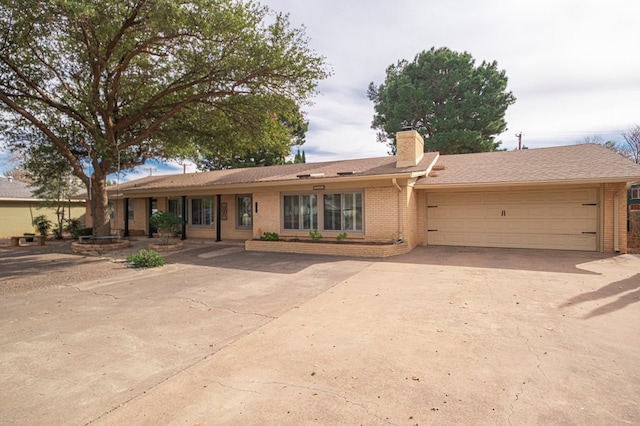 single story home featuring a garage