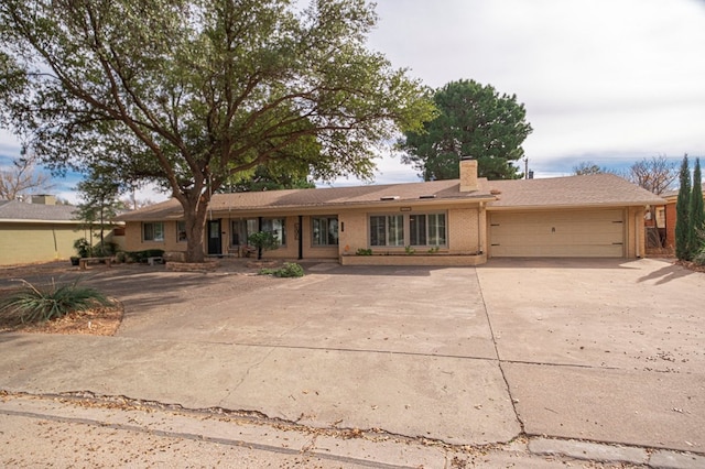 ranch-style house featuring a garage