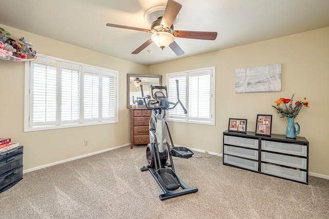 workout room with light carpet and ceiling fan