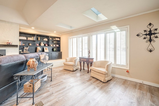 living room featuring built in shelves, crown molding, and wood-type flooring