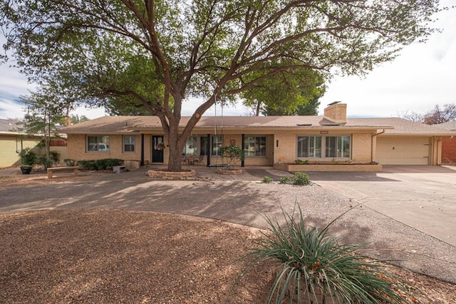 ranch-style home featuring a garage