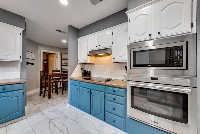 3906 Lehigh Dr, Midland, TX 79707 - kitchen with appliances with stainless steel finishes, blue cabinetry, under cabinet range hood, white cabinets, and recessed lighting