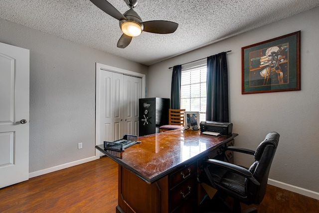 3906 Lehigh Dr, Midland, TX 79707 - office featuring a textured ceiling, ceiling fan, dark wood-style floors, and baseboards