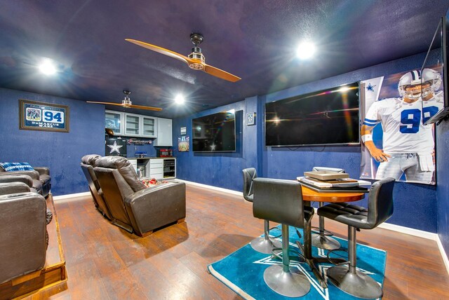 3906 Lehigh Dr, Midland, TX 79707 - home theater room with wood finished floors, baseboards, recessed lighting, wine cooler, and a ceiling fan
