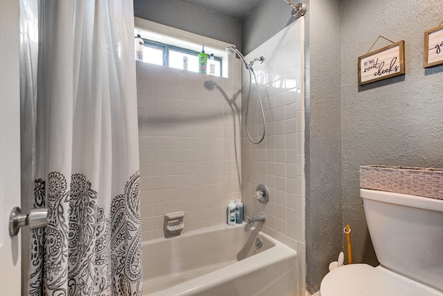 3906 Lehigh Dr, Midland, TX 79707 - bathroom featuring a textured wall, shower / tub combo, and toilet