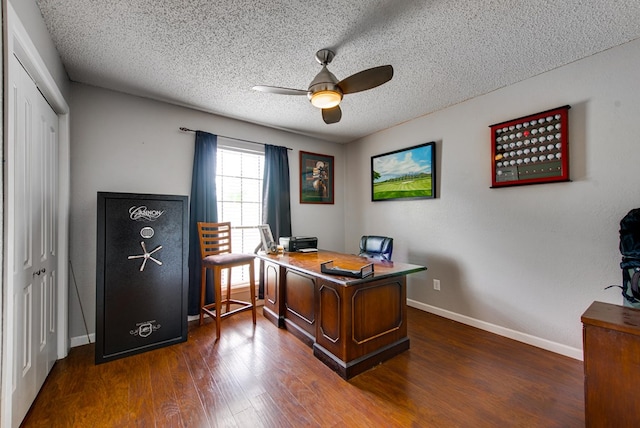 3906 Lehigh Dr, Midland, TX 79707 - office area with a ceiling fan, a textured ceiling, dark wood-type flooring, and baseboards