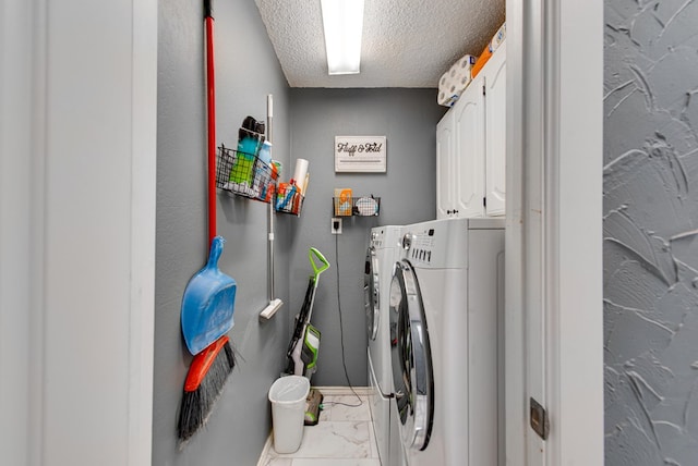 3906 Lehigh Dr, Midland, TX 79707 - washroom with washing machine and dryer, marble finish flooring, cabinet space, and a textured ceiling