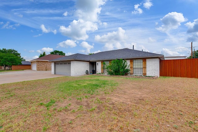3906 Lehigh Dr, Midland, TX 79707 - single story home with driveway, brick siding, and an attached garage