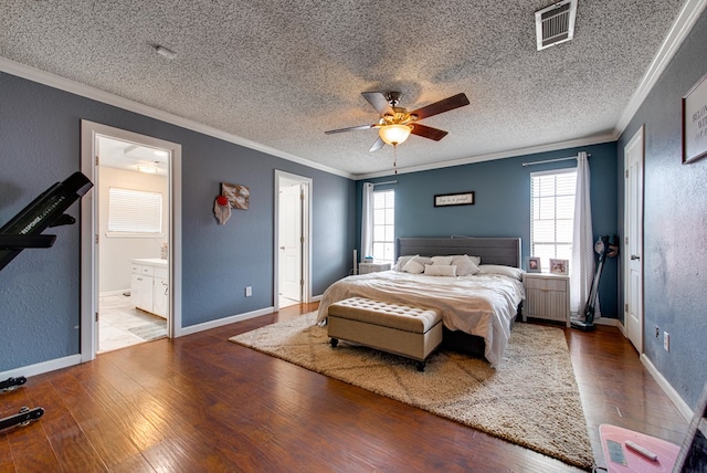 3906 Lehigh Dr, Midland, TX 79707 - bedroom with ornamental molding, a textured ceiling, multiple windows, hardwood / wood-style flooring, and a textured wall
