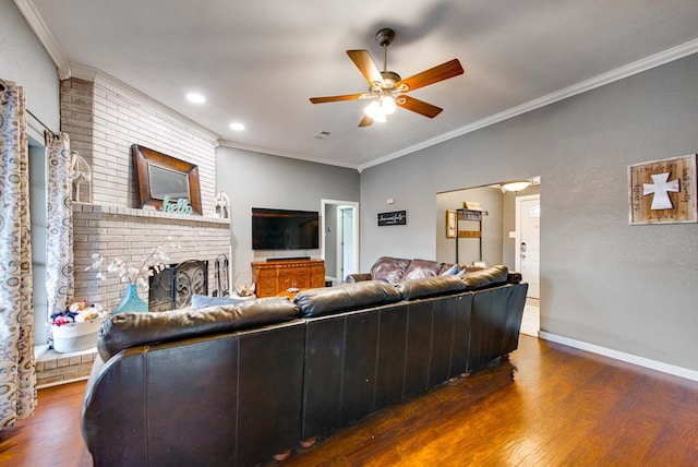 3906 Lehigh Dr, Midland, TX 79707 - living area featuring ceiling fan, ornamental molding, wood finished floors, baseboards, and a fireplace
