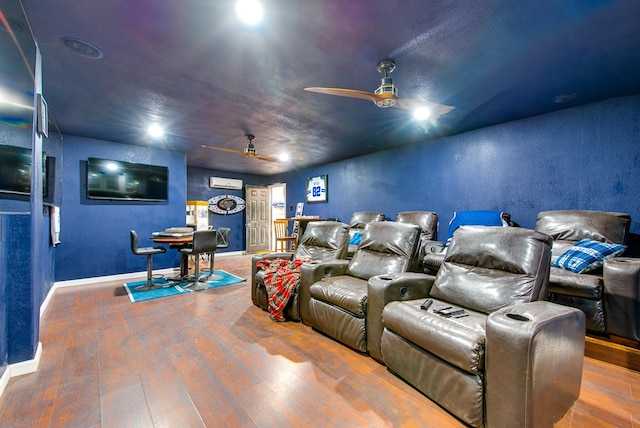 3906 Lehigh Dr, Midland, TX 79707 - home theater with a ceiling fan, an AC wall unit, wood finished floors, baseboards, and recessed lighting