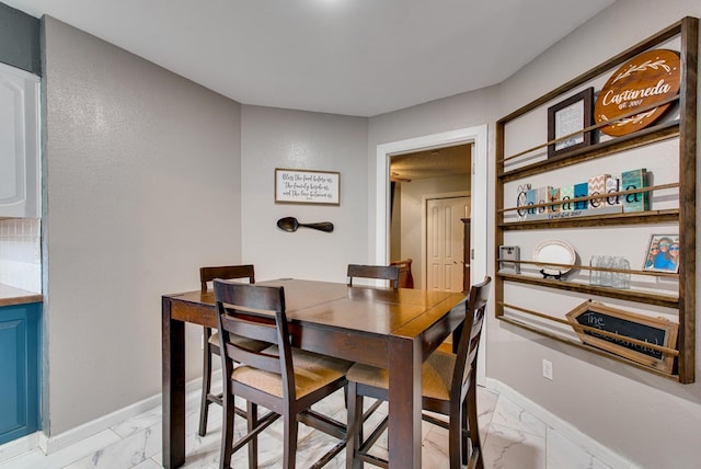 3906 Lehigh Dr, Midland, TX 79707 - dining area featuring light marble finish flooring and baseboards