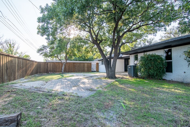 view of yard featuring cooling unit and fence private yard