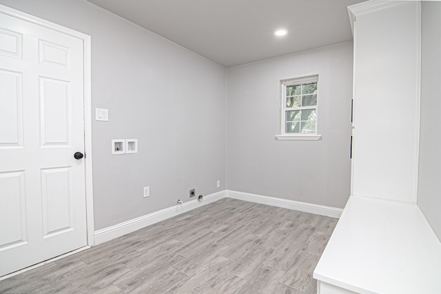 empty room with recessed lighting, baseboards, and light wood-style floors