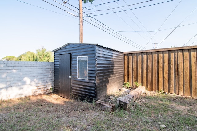 view of shed featuring a fenced backyard