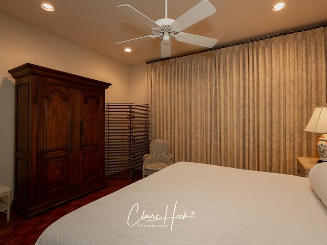 bedroom featuring dark parquet floors and ceiling fan