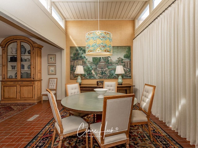 dining area with a high ceiling