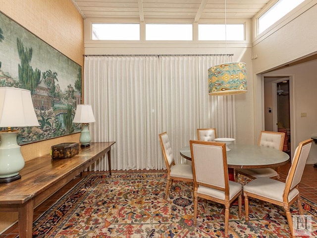 dining area featuring a high ceiling