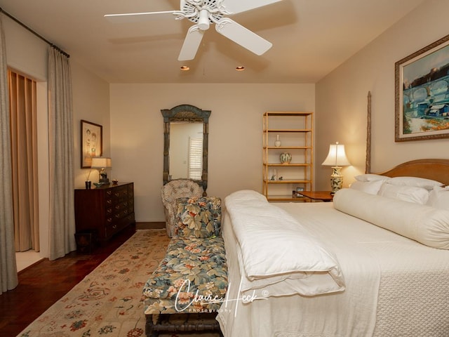 bedroom featuring ceiling fan and dark wood-type flooring