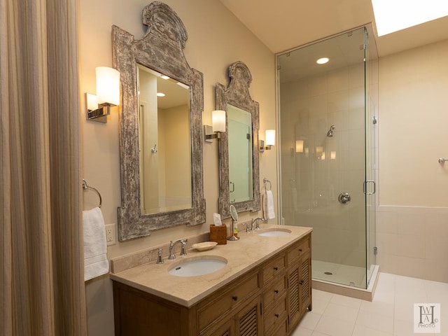 bathroom with tile patterned floors, vanity, and an enclosed shower