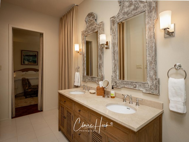 bathroom with tile patterned flooring and vanity